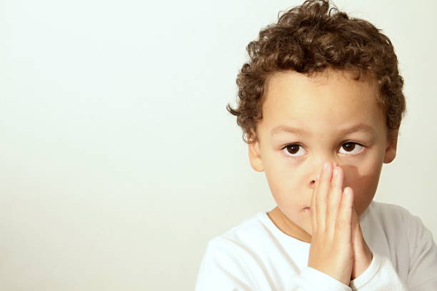 istock little boy praying to God 1161531554