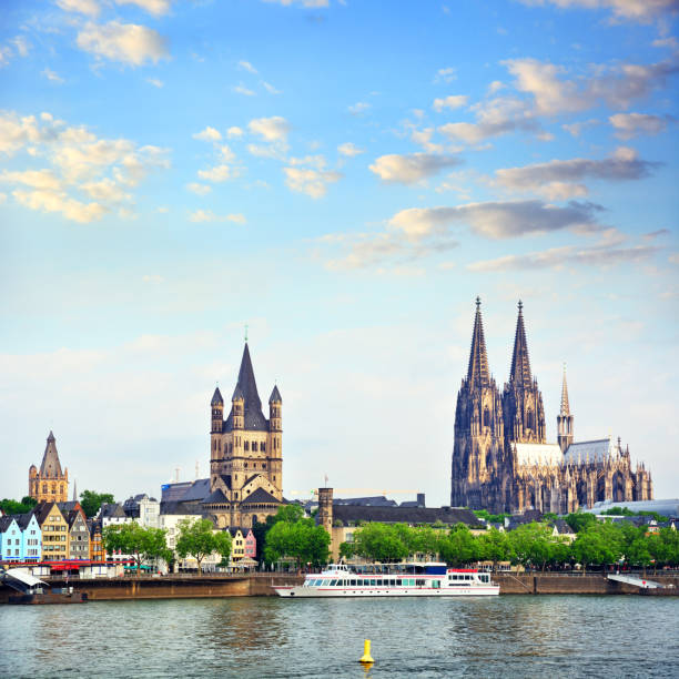 Rhine River in Cologne, Germany Riverbank of Rhine River in Cologne at sunrise, Germany. Composite photo koln germany stock pictures, royalty-free photos & images