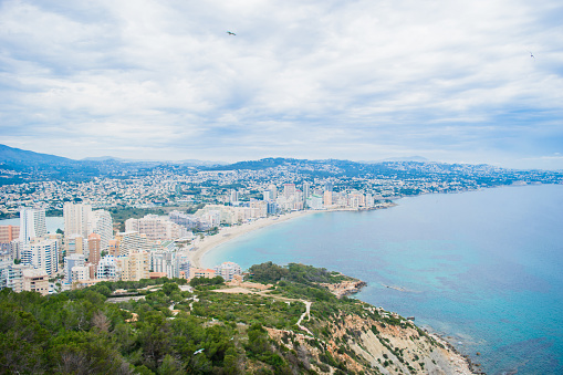 The beautiful view from famous rock Penon de Ifach of at Costa Blanca to the shore of the city Calpe, Spain.