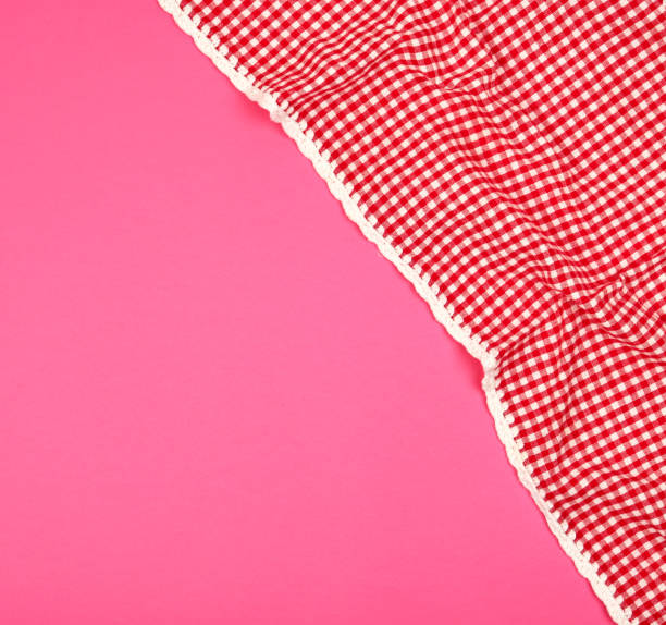 istock white red checkered kitchen towel on a pink background 1161533659