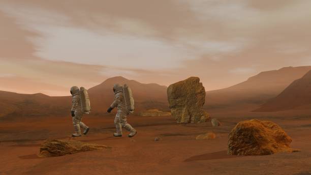 istock 3D rendering. Colony on Mars. Two Astronauts Wearing Space Suit Walking On The Surface Of Mars. 1161537140