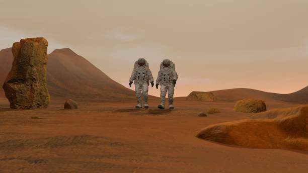 istock 3D rendering. Colony on Mars. Two Astronauts Wearing Space Suit Walking On The Surface Of Mars. 1161537220