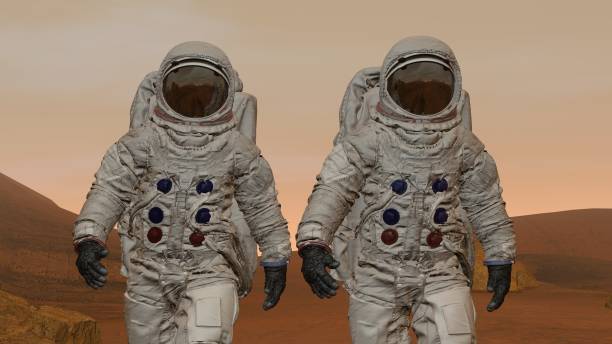 istock 3D rendering. Colony on Mars. Two Astronauts Wearing Space Suit Walking On The Surface Of Mars. 1161537258