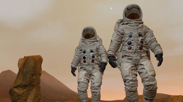 istock 3D rendering. Colony on Mars. Two Astronauts Wearing Space Suit Walking On The Surface Of Mars. 1161537445