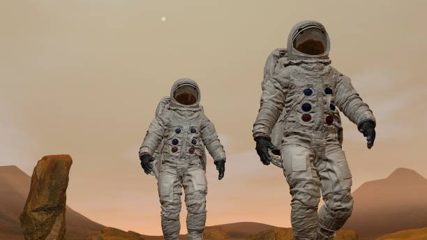 istock 3D rendering. Colony on Mars. Two Astronauts Wearing Space Suit Walking On The Surface Of Mars. 1161537494