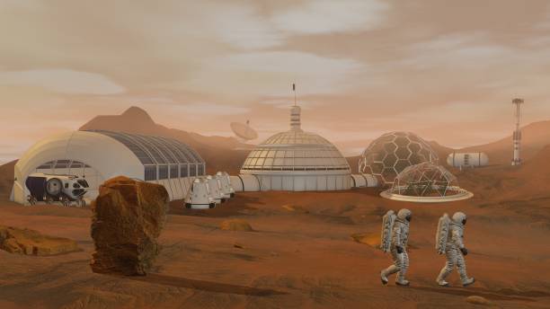istock 3D rendering. Colony on Mars. Two Astronauts Wearing Space Suit Walking On The Surface Of Mars. 1161537566