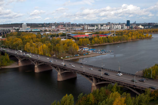 Bridge over yenisei river and city in background Autumn scene from around Krasnoyarsk, Russia krasnoyarsk photos stock pictures, royalty-free photos & images