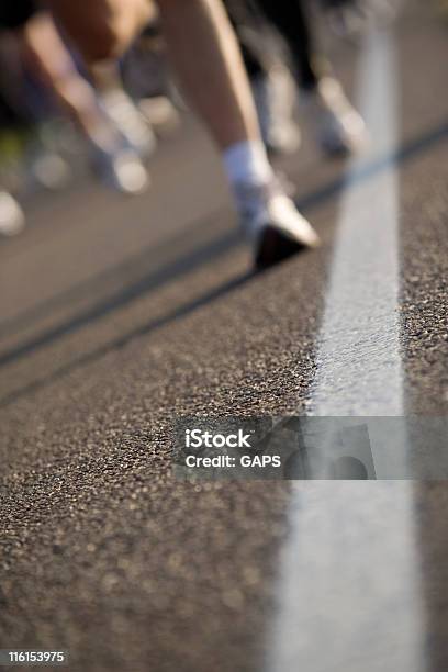 Runners On An Asphalt Road Stock Photo - Download Image Now - Asphalt, Athlete, Color Image