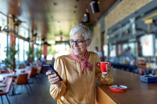 istock Senior woman in coffee shop 1161540644