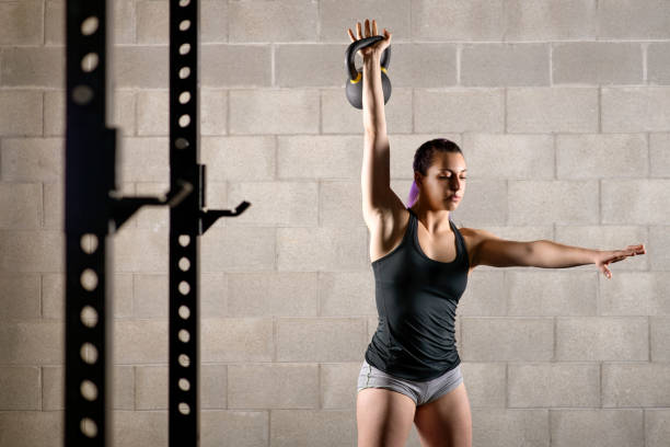 istock Young Woman Exercising At Gym 1161540806