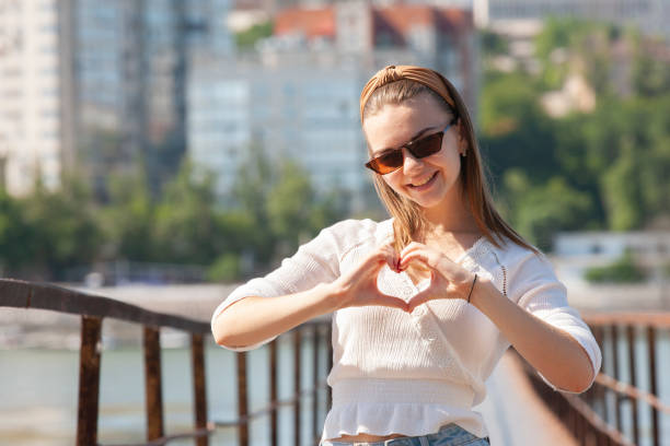 istock Young woman on the pier at the river. 1161543017