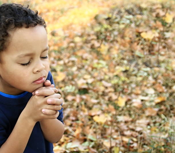 istock little boy praying to God 1161543206