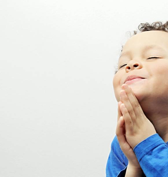 istock little boy praying to God 1161543259