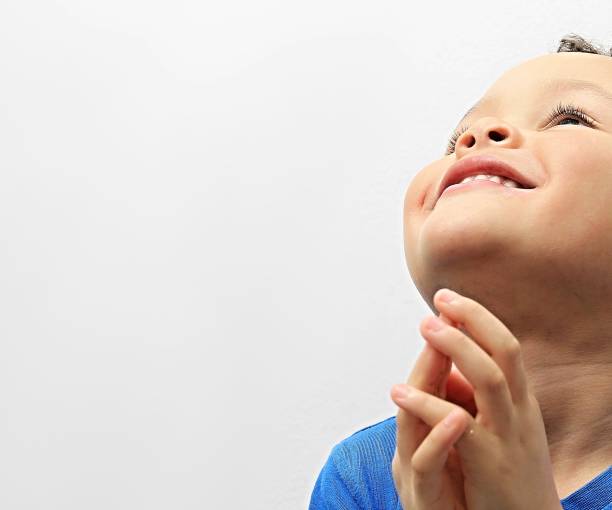 istock little boy praying to God 1161543872