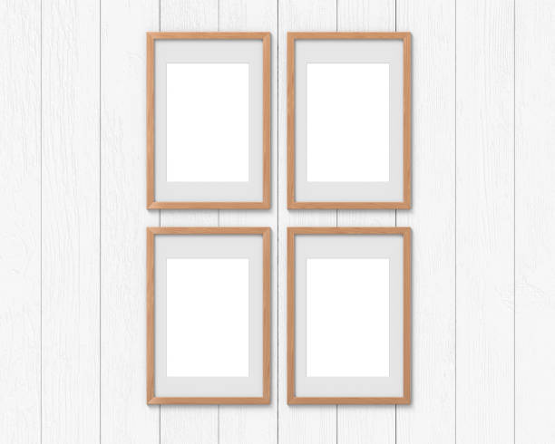 istock Set of 4 vertical wooden frames mockup with a border hanging on the wall. Empty base for picture or text. 3D rendering. 1161544531