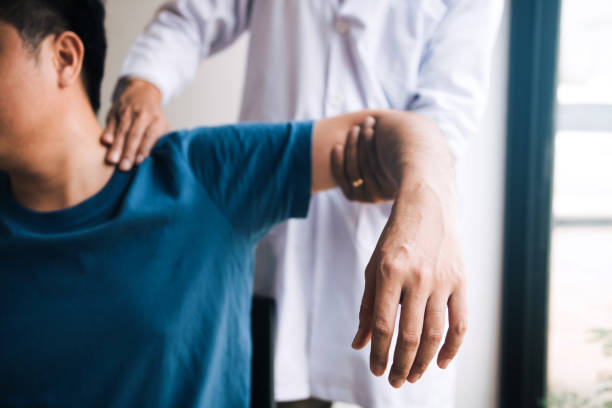 istock Physical therapists press to the patient shoulder check for pain. 1161545177