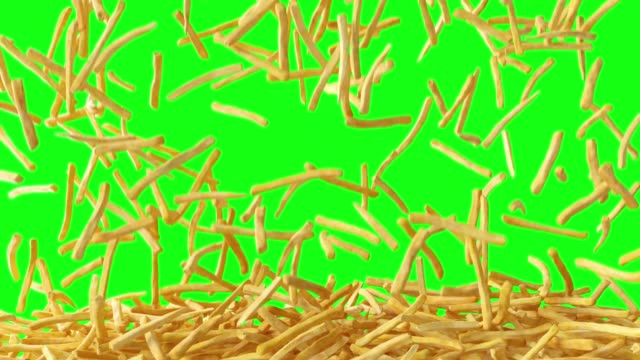 Fried potato chips falling down from top, fast food, junk food background texture pattern on green screen