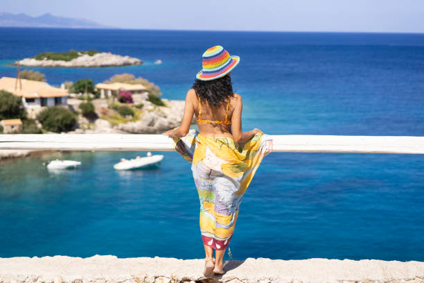 istock Woman standing on harbor and looking at view 1161545945