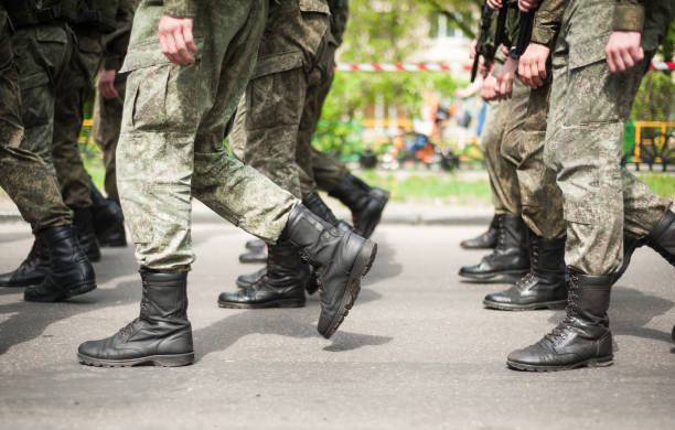 istock Marching soldiers in military boots 1161552558