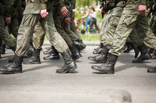 istock Marching soldiers in military boots 1161552576