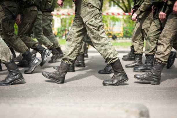 istock Marching soldiers in military boots 1161552591