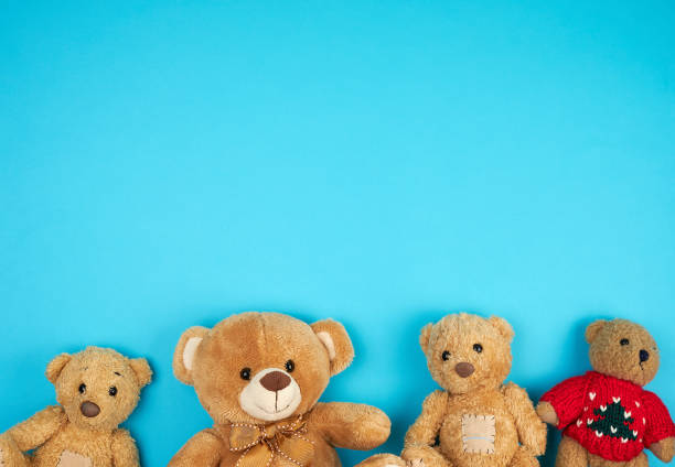 istock four teddy bears on a blue background, friendship concept 1161553815