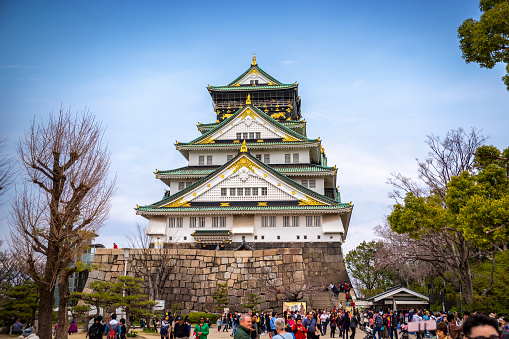 Osaka, Japan - March 28, 2019 : Osaka castle and tourist people in spring before cherry blossom