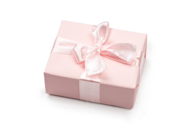 istock Gift box wrapped in pastel  paper with pink ribbon isolated 1161555242