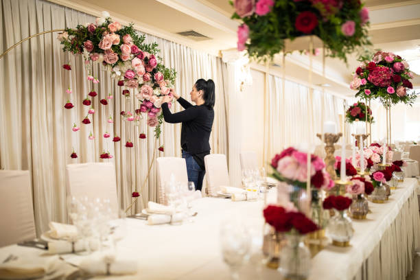 istock Unrecognizable woman preparing wedding decoration 1161558437