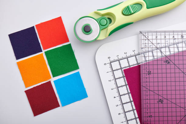 istock Bright square pieces of fabric and quilting accessories 1161560712