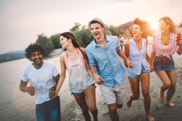 istock Group of friends enjoying beach vacation and having fun 1161563405