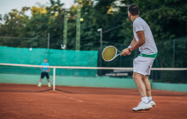 istock Two men tennis players playing a match 1161563445