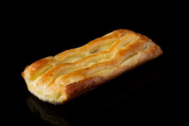 istock Bun with puff pastry with cottage cheese on a dark background 1161564805