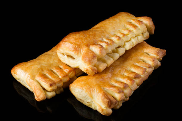 istock Bun with a puff pastry on a dark background 1161564818