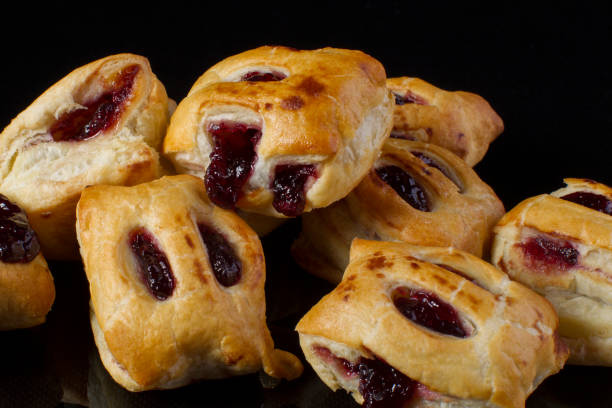 istock Puff pastry with jam closeup on a dark background 1161564883