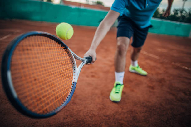 istock Tennis player hitting a ball 1161565256