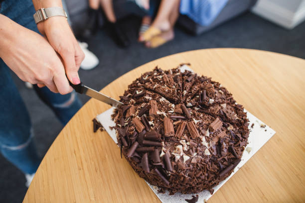 istock Slicing A Piece of Birthday Cake 1161566400