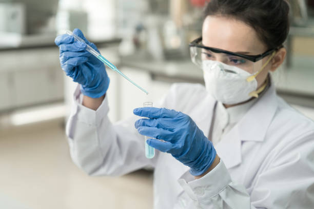 young female scientist working in the cdc laboratory - department of health and human services imagens e fotografias de stock