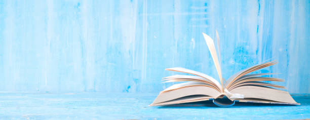 istock open book, close up on blue grungy background,reading, education, literature,learning, good copy space 1161567053