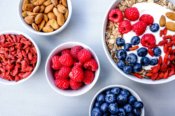 Vegetarian Breakfast Bowl of Muesli With Fresh Fruit Nuts and Yogurt