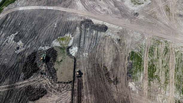 istock Top view of mining machines in limestone mine. 1161569667