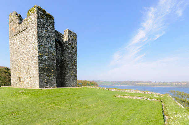Doolin, Ireland -  August 28, 2011: Doonagore castle at the Atlantic Ocean in Doolin, Co. Clare, Ireland
