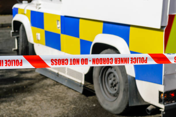 istock Armoured plice vehicle inside inner cordon at a scene of crime. 1161574939