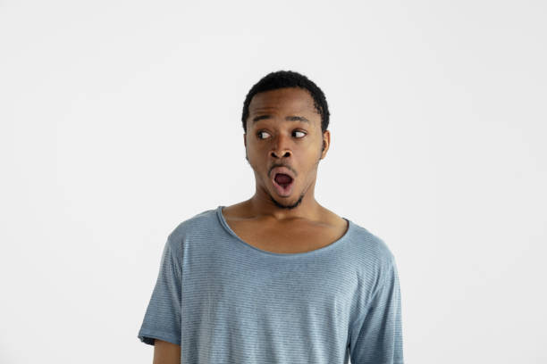 istock Portrait of young man isolated on white studio background 1161577824