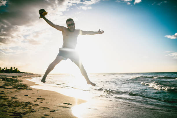 istock Male Jumping During Sea Sunset 1161578628