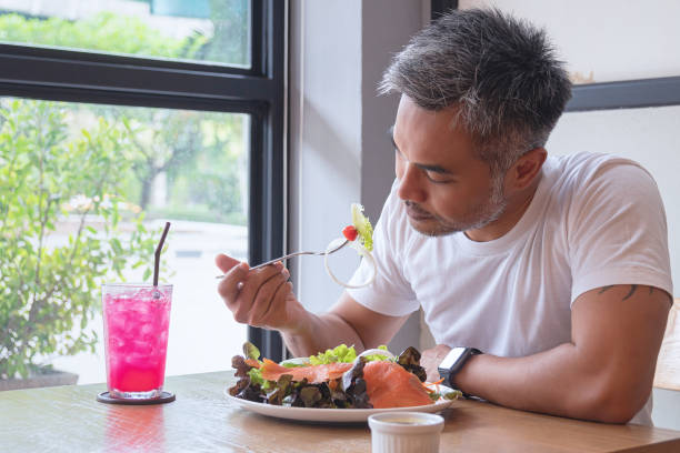 istock Young happy man enjoying in a healthy meal 1161579868
