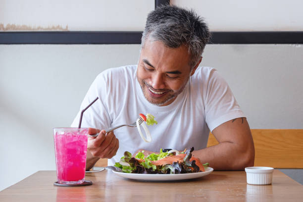 istock Young happy man enjoying in a healthy meal 1161579871