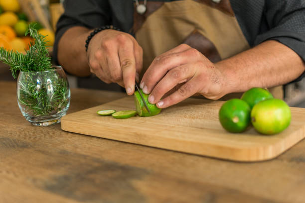 istock Waiter preparing a cocktail cutting lima 1161580053