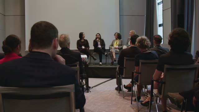 Panel of female experts explaining during seminar