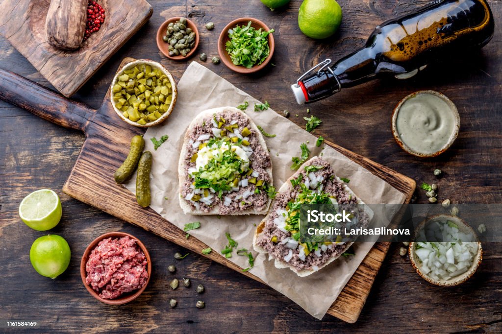 Raw meat sandwiches. CRUDO VALDIVIANO. tipical chilean food from region Valdivia. Chilean food, aleman food. Tartar sandwiches. Raw meat sandwiches. CRUDO VALDIVIANO. tipical chilean food from region Valdivia. Chilean food, aleman food. Tartar sandwiches Food Stock Photo